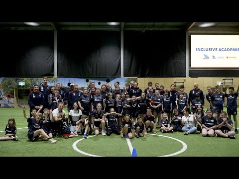 Inclusive Crows Academy kicking goals